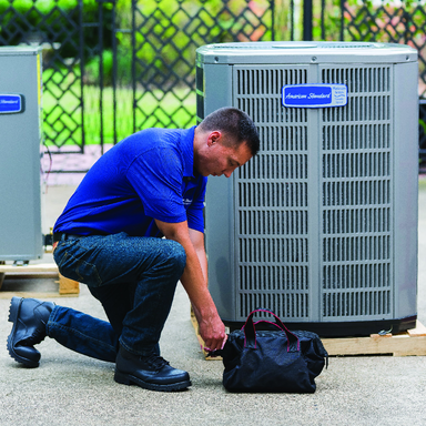 Service Technician Replaces Air Conditioner